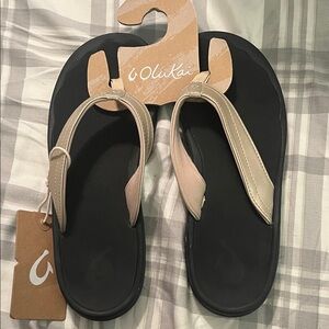 OluKai Women's Sandals in Black and gold